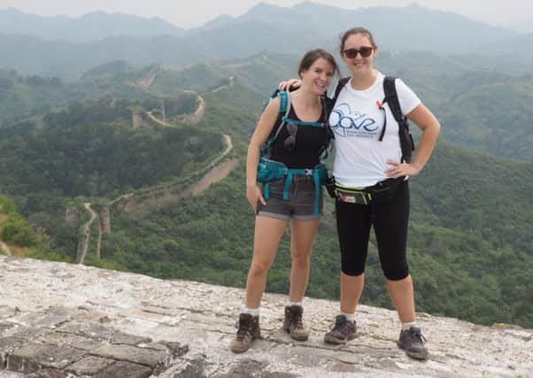 Victoria Goldstein and Ria Prior climbing the Great Wall of China PHOTO: Supplied