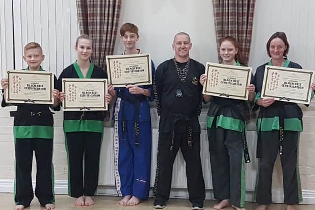 Instructor Stuart Davison is pictured with some of his successful students.