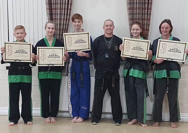 Instructor Stuart Davison is pictured with some of his successful students.