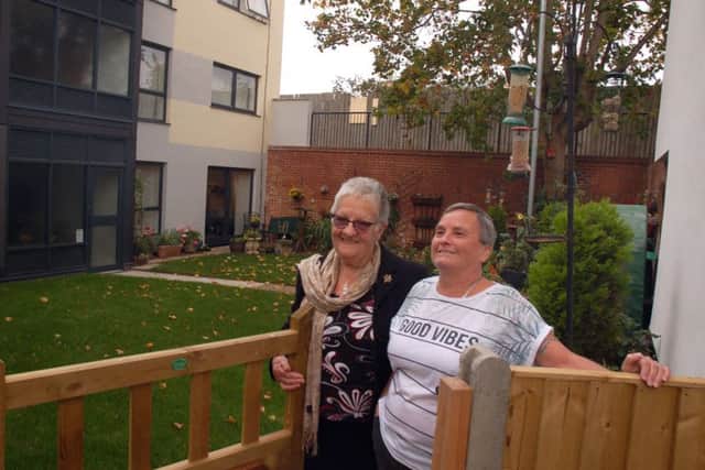 Margaret Exton (left) outside her lovingly-tendered garden at Beckmill Court flats with fellow resident, Karen Barber-Stevens EMN-181026-142347001