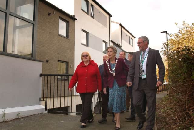 Dignitaries including Mayor of Melton, Councillor Pru Chandler, tour the refurbished Beckmill Court flats in the town EMN-181026-142358001