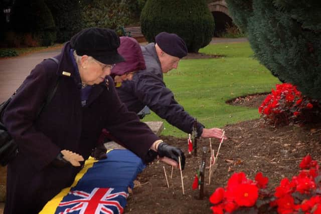 A short service of re-dedication of Melton's Memorial Gardens given by Rev James Skinner, with prayers, the Last Post and planting of memorial crosses by representatives from Melton Town Estate, the town branch of the Royal British Legion, Keswick House Ladies, Group, the Mayor of Melton and the Defence Animal Training Regiment EMN-181029-112238001