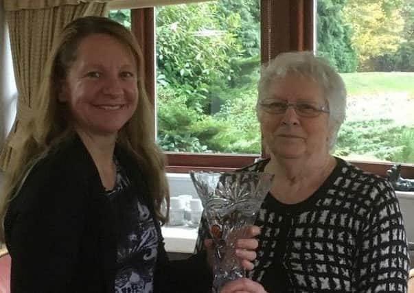 Ruth Greenfield presents the Golden Jubilee Trophy to Penny Hallam EMN-181030-174431002