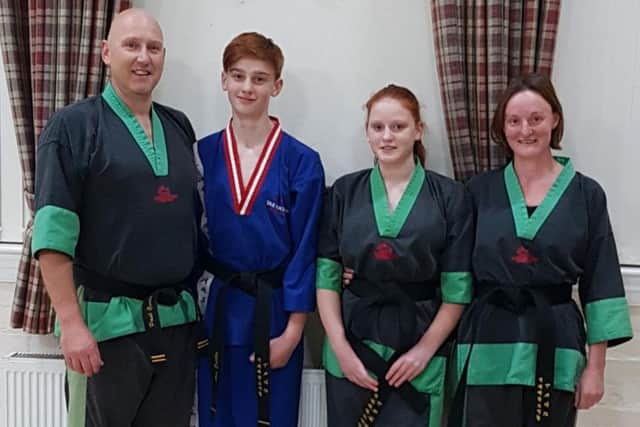 The Curtis family of black belts - dad Paul, Alex, Hayley and mum Ellie EMN-181031-121639002