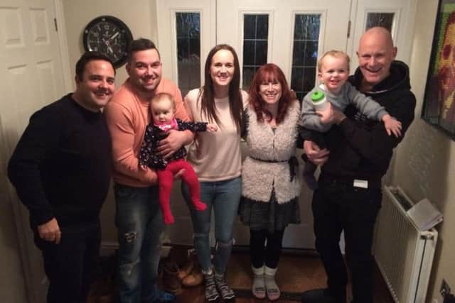 Ray Walker (right) with wife Vanessa, his three children and two grandchildren EMN-180511-155211001