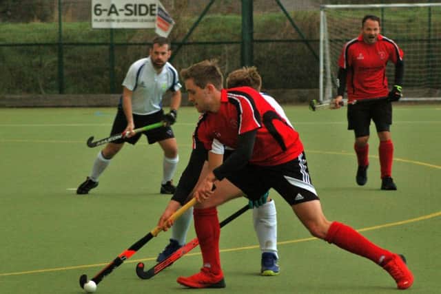 James Hewitt hangs on to possession as Melton's First XI edged to their fifth league win of the season EMN-181113-113518002