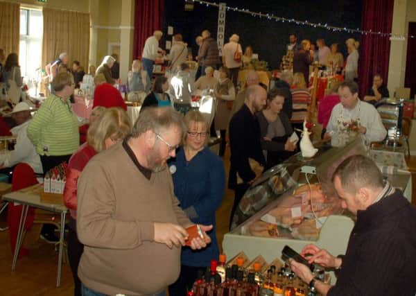 Food, drink and Christmas crafts attract the crowds to the village hall PHOTO: Tim Williams
