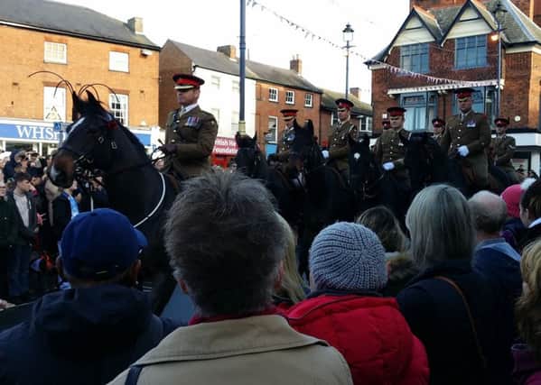 Melton Defence Animal Training Regiment personnel and their horses pictured in Melton's Market Place during the parade to mark Remembrance Sunday and the 100th anniversary of the end of the First World War EMN-181111-154115001