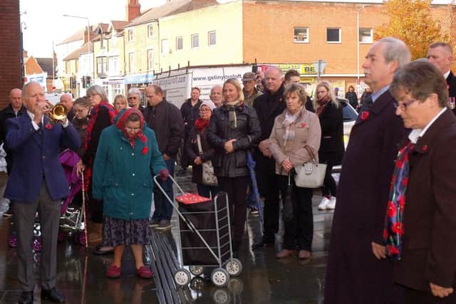 Phil Hardy sounds the Last Post at the remembrance service outside the Melton branch of the Royal British Legion EMN-181211-103558001