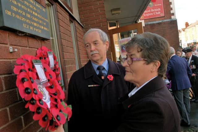 Wreath-layers Erica Fish, from the Keswick Ladies section, and Bol Boniewicz, representing the Polish community, at the remembrance service outside the Melton branch of the Royal British Legion EMN-181211-103608001