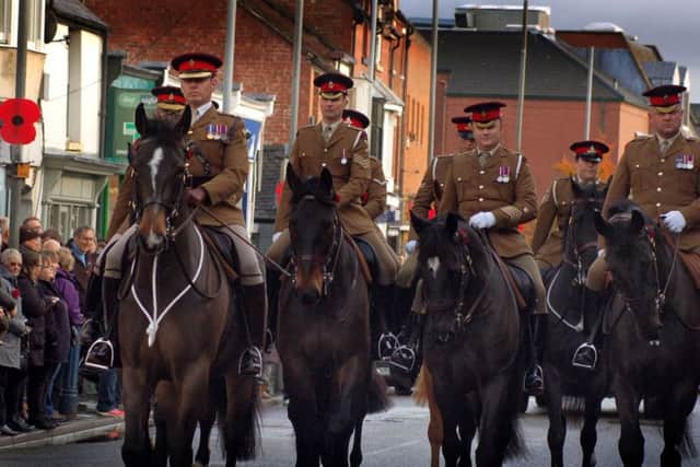Members of the Melton-based Defence Animal Training Regiment and their horses take part in the Remembrance Sunday parade EMN-181211-104933001