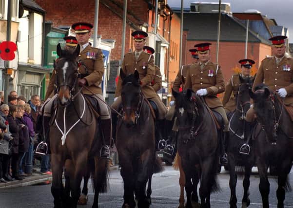 Members of the Melton-based Defence Animal Training Regiment and their horses take part in the Remembrance Sunday parade EMN-181211-104933001
