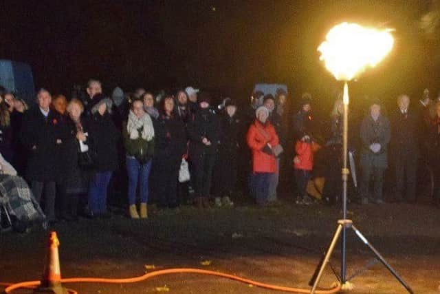 Mayor of Melton, Councillor Pru Chandler, reads the names of fallen town service personnel during a short service of commemoration in Play Close park, Melton, on Remembrance Sunday
PHOTO PHIL BALDING EMN-181211-112251001