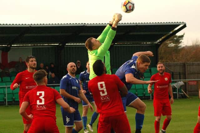 Town goalkeeper Rob Peet came to Town's rescue a few times during a tight first half EMN-181113-083831002