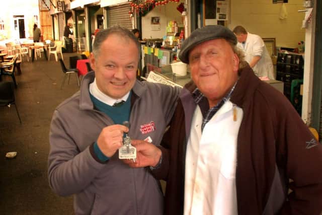Melton Cattle Market chief executive Hugh Brown, left, hands the keys to Stuart Scarborough.