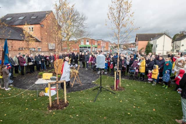 Villagers at Asfordby gather round the new ironstone tribute for an open air service of Remembrance on Sunday
PHOTO Sean Strange Photography EMN-181114-095700001