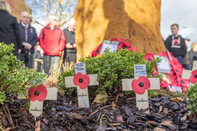 Villagers at Asfordby gather round the new ironstone tribute for an open air service of Remembrance on Sunday
PHOTO Sean Strange Photography EMN-181114-095649001