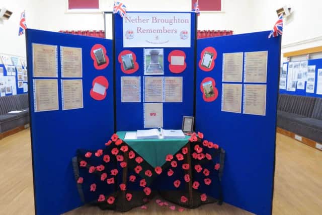 A display honouring fallen servicemen in the village hall at Nether Broughton EMN-181114-100340001