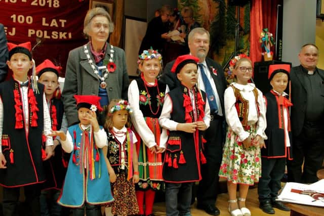 Children in traditional Polish dress with Mayor of Melton, Councillor Pru Chandler, at the event celebrating 70 years of the community in Melton
PHOTO Rafal Orzech EMN-181113-162120001