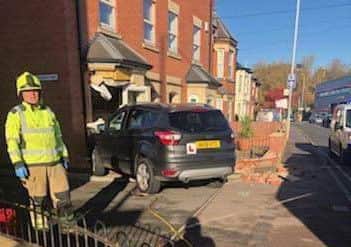 A car pictured embedded in the front of a house on Nottingham Road, Melton, following Tuesday's accident EMN-181114-155224001