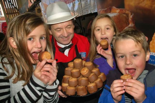 Chocolate dipped Dickinson and Morris pork pies went down well with Amelia, Scarlett and Oscar Lilley PHOTO: Tim Williams