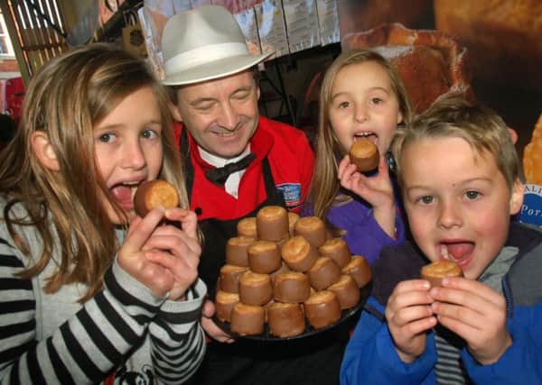 Chocolate dipped Dickinson and Morris pork pies went down well with Amelia, Scarlett and Oscar Lilley PHOTO: Tim Williams