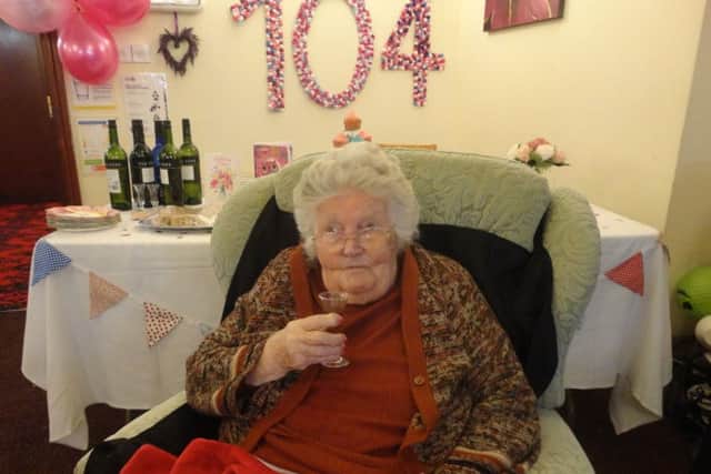 Agnes Bull toasts her 104th birthday at a party at Waltham Hall nursing home EMN-181119-154014001
