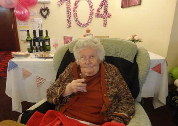 Agnes Bull toasts her 104th birthday at a party at Waltham Hall nursing home EMN-181119-154014001
