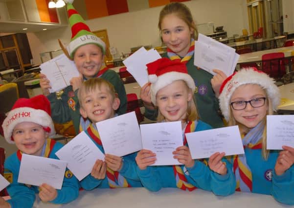 The Scouts start sorting their Christmas post ready for delivery PHOTO: Tim Williams