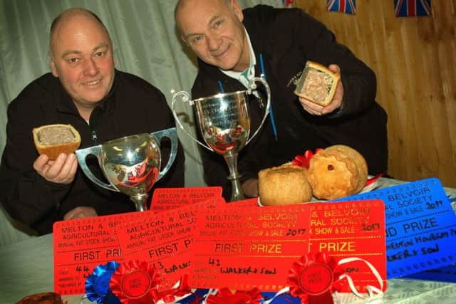 Walkers' master pie makers Guy Coombs and Ian Heircock with their haul of cups and rosettes at the 2017 Melton Christmas Fatstock Show and Sale EMN-181128-160313001