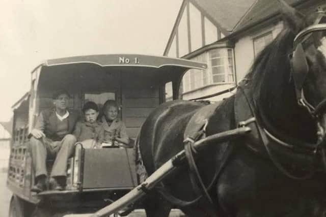 Stuart Townend pictured on his Melton milk round in the early 1950s giving local children a ride on his horse and cart EMN-180412-102007001