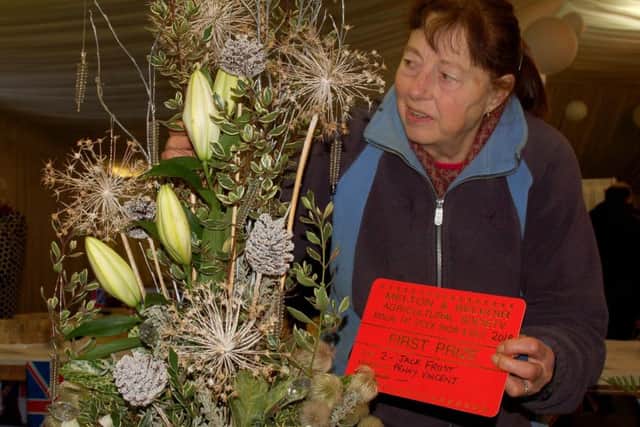 Penny Vincent with her winning floral entry in the 'Jack Frost' category at the 2018 Christmas Fatstock Show and Sale EMN-180412-165030001