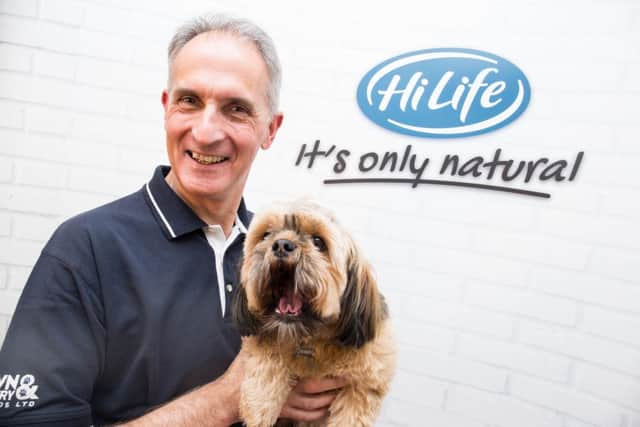 Managing director Tony Parkinson with Chewie the dog.