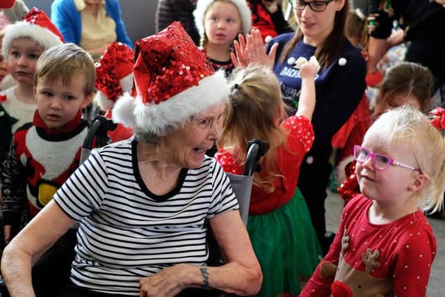 Betty Orton, (89), chatting to Charlotte as she enjoys the visit of Early Years Norman Way Nursery to The Amwell PHOTO: John Robertson