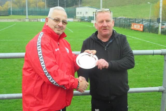 Club chairman Phil Baker presents a plaque to Monaghan chairman Ronan Callan to mark the clubs friendship EMN-181218-152512002
