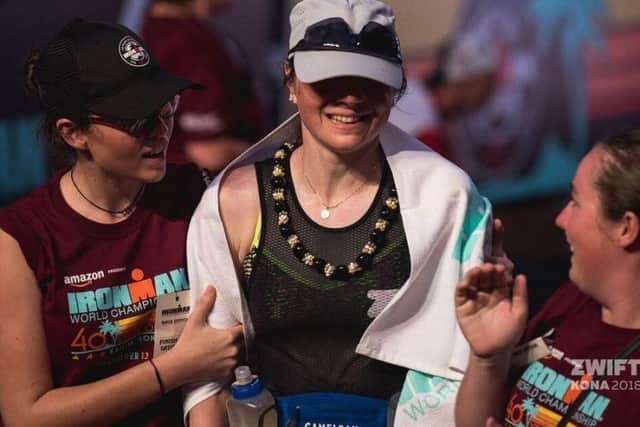 Exhausted and emotional after crossing the line in Kona EMN-181221-111244002