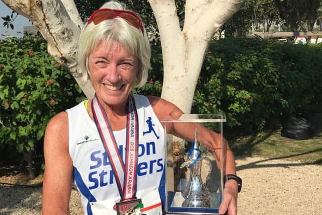 Julie Bass with her latest trophy - after winning the grandmaster (over 60s) first prize at the Dubai Half-Marathon EMN-181221-135812002