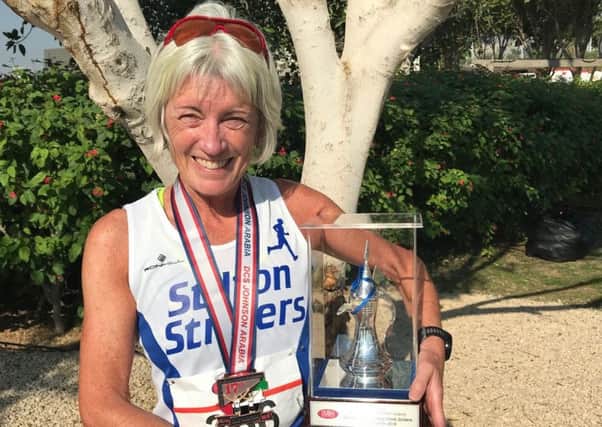 Julie Bass with her latest trophy - after winning the grandmaster (over 60s) first prize at the Dubai Half-Marathon EMN-181221-135812002