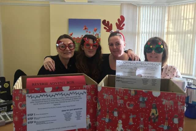 NFU Mutual staff in Melton with their reverse advent boxes, collecting for Storehouse (left to right): Amanda Thomas, Georgia Attwood, Sasha Bailey and Dawn Shaw PHOTO: Supplied