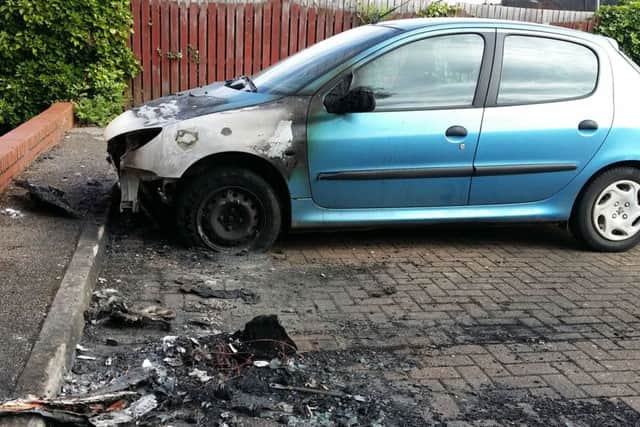 A Peugeot 206 damaged in Drummond Walk during an arson attack on the Fairmead Estate in Melton EMN-181227-121516001