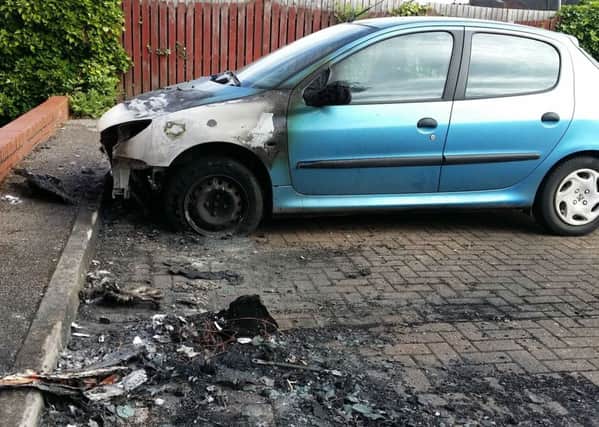 A Peugeot 206 damaged in Drummond Walk during an arson attack on the Fairmead Estate in Melton EMN-181227-121516001