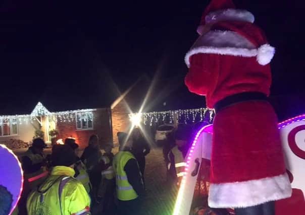 Santa out and about with Lions helpers PHOTO: @VOBlions
