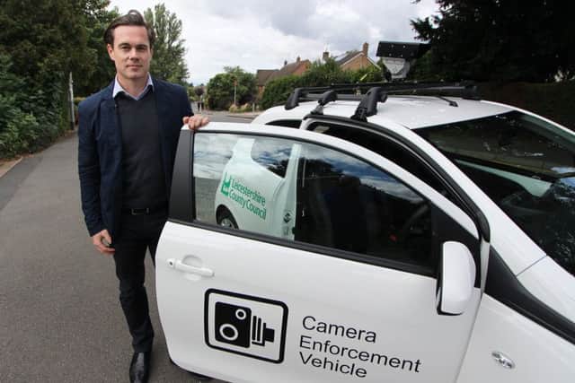 Councillor Blake Pain with the camera enforcement vehicle being used by Leicestershire County Council to clamp down on motorists who park irresponsibly outside schools EMN-190901-145421001