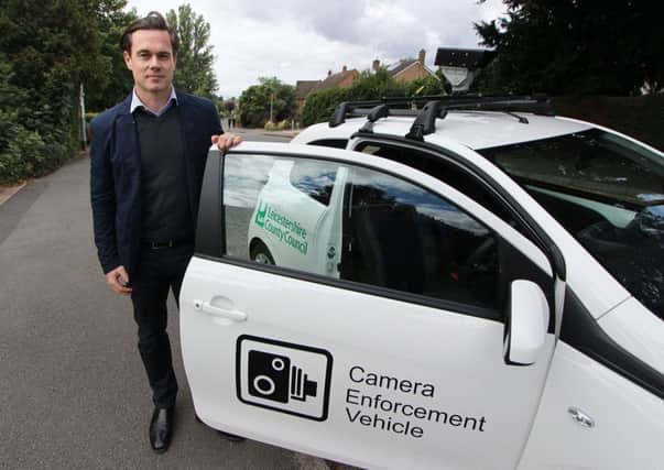 Councillor Blake Pain with the camera enforcement vehicle being used by Leicestershire County Council to clamp down on motorists who park irresponsibly outside schools EMN-190901-145421001