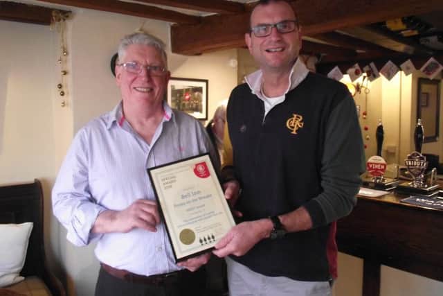 Robert Smith, landlord at The Bell pub at Frisby, received a coveted merit award from Melton CAMRA chairman Kevin Billson EMN-190301-155305001