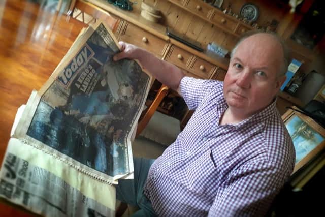 Former Melton police officer Phil Frier looks through the scrapbook he has kept with press cuttings from the Kegworth air disaster, where he was involved in the rescue effort in 1989 EMN-190901-092354001