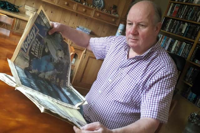 Former Melton police officer Phil Frier looks through the scrapbook he has kept with press cuttings from the Kegworth air disaster, where he was involved in the rescue effort in 1989 EMN-190901-092404001