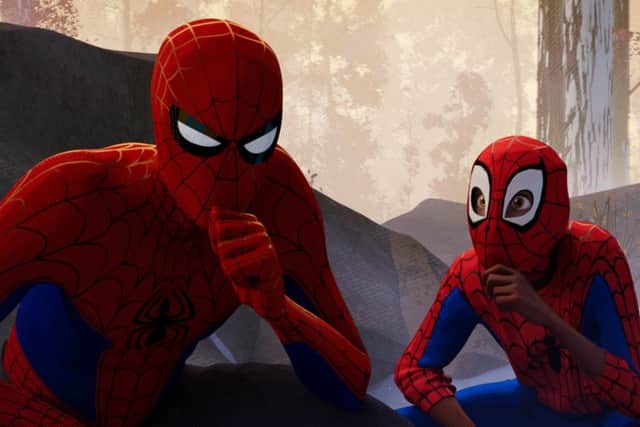 (Left to right): Peter Parker (voiced by Jake Johnson) and Miles Morales (voiced by Shameik Moore) PHOTO: PA Photo/CTMG, Inc./Sony Pictures Animation