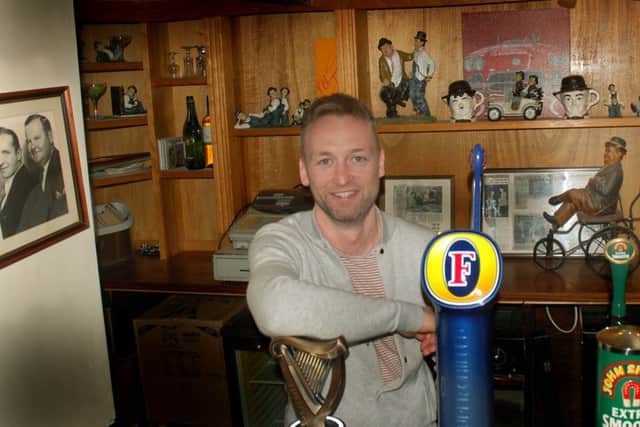 Landlord Callum McIver with some of the Laurel and Hardy memorabilia at The Bull Inn, at Bottesford EMN-190116-091613001