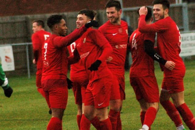 Co-manager Jon Stevenson (left), who made only his second Town start after injury, celebrates Parsons' opener EMN-190121-094136002